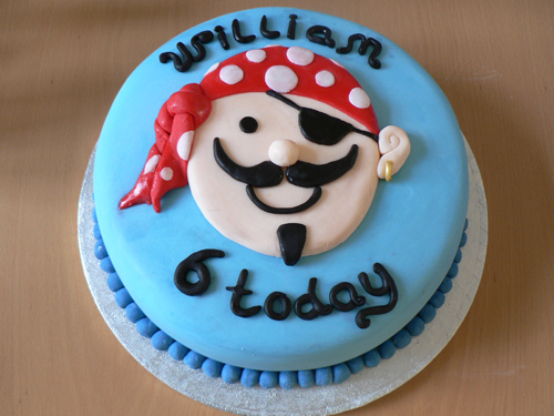 Pirate Cake This cake is covered in blue sugar icing and decorated with a